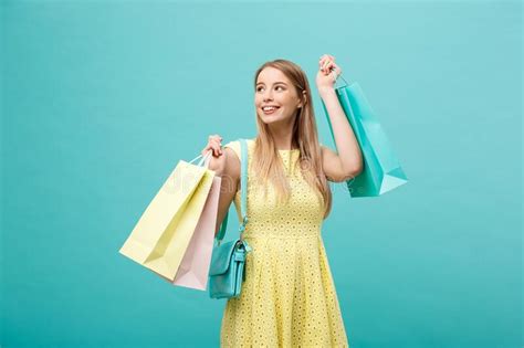 Lifestyle Concept Portrait Of Shocked Young Attractive Woman In Yellow Summer Dressposing With