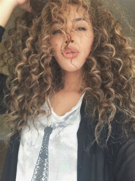 If blonde is too light for you, consider caramel highlights on chocolate brown hair. Natural Curly Hair Blonde Highlights | Blonde highlights ...