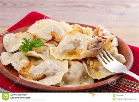 Dumplings Filled With Meat And Served With Salty Caramelized Onion