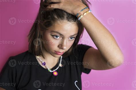 Portrait Of A Beautiful Caucasian Girl Shaking Her Hair Posing On A Pink Background 18789060
