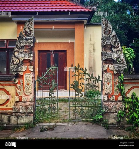 Entance To A Modern Balinese House Consisting Of A Traditional Candi