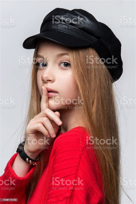 Closeup Portrait Of Beautiful Young Redhead Girl Wearing Red Sweater