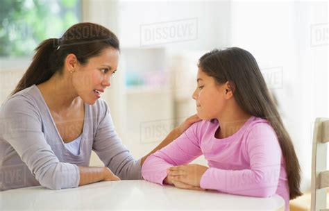 Mother With Daughter 10 11 Talking At Home Stock Photo Dissolve