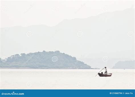 A Fisherman On Boat Alone In The Sea Stock Photo Image Of Fish
