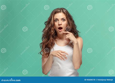 Portrait Of Young Woman With Shocked Facial Expression Stock Photo