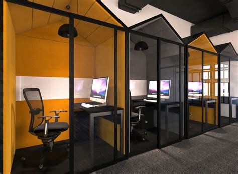 An Office Cubicle With Glass Walls And Yellow Accenting The Space