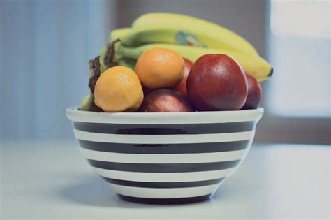 Download Striped Fruit Bowl With Apples Bananas And Oranges Royalty Free