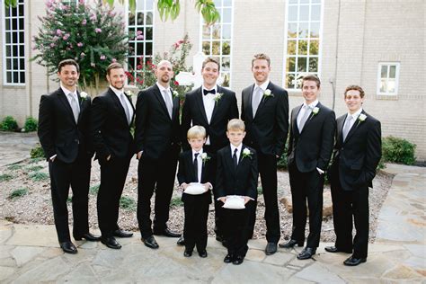 classic black groomsmen suits and groom tuxedo