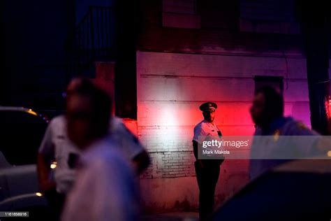 a police officer monitors activity near a residence while responding news photo getty images