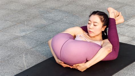 Side View Of Healthy Women In Sportswear Practicing Yoga