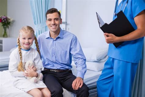 Premium Photo Portrait Of Sick Girl And Father In Hospital Bed