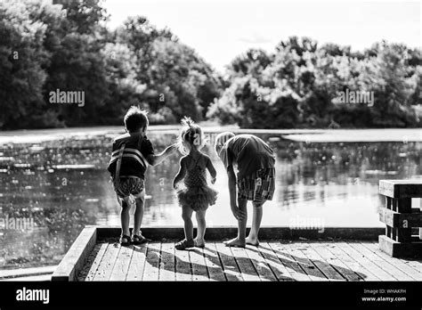 Three Children Playing Lake Hi Res Stock Photography And Images Alamy