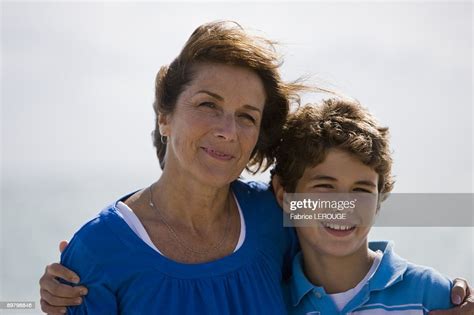 Portrait Of A Woman Smiling With Her Grandson High Res Stock Photo