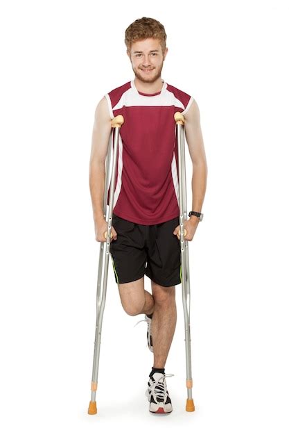 Injured Sport Man On Crutches Premium Photo