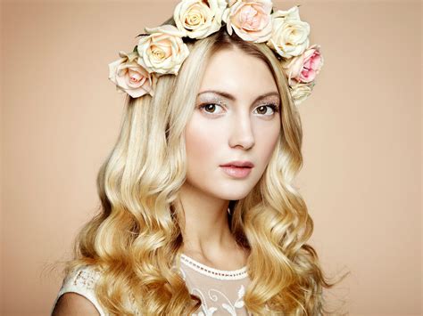 Portrait Of A Beautiful Blonde Woman With Flowers In Her Hair