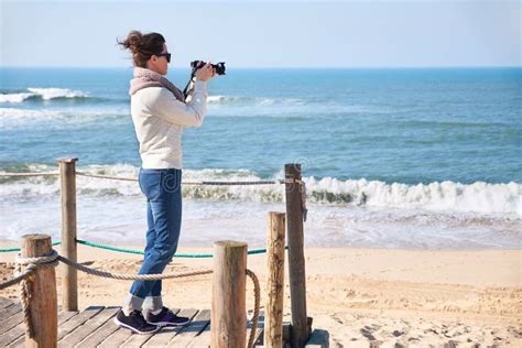 Woman Photographer Taking Photos At A Beach Stock Photo Image Of Outside Beach