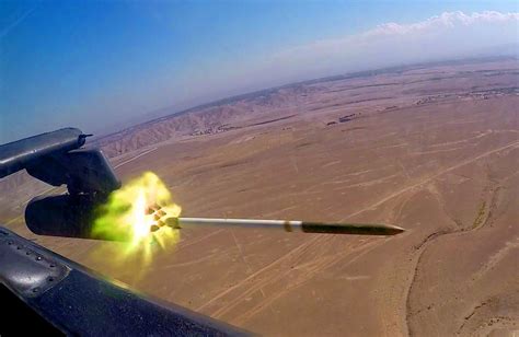 A Hydra 70 Rocket Being Fired From An Apache Above Afghanistan