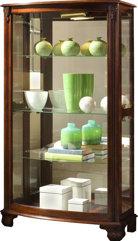 Two wooden platforms with a mirrored back reflect every detail. Gallery Style 3 Shelf Fluted Mirrored Lighted Curio ...