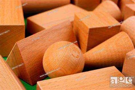 Wooden Geometric Shapes On A Green Background Stock Photo Picture And