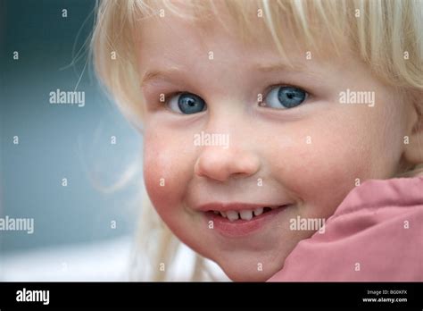 Closeup Face Of Beautiful Smiling Grey Eyed Infant Girl Stock Photo Alamy