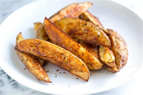 Place potatoes skin down in a baking dish. Rosemary Baked Potato Wedges