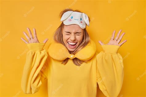Free Photo Overjoyed Emotional Woman Raises Palms Exclaims Loudly From Joy Keeps Eyes Closed