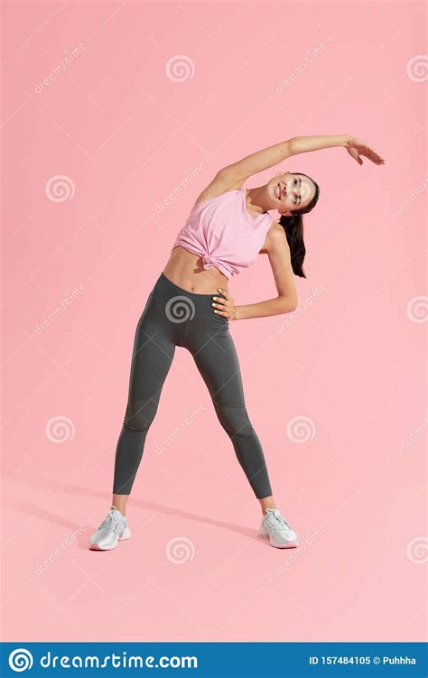 Stretch Sport Woman Stretching Body Warm Up On Pink Background Stock