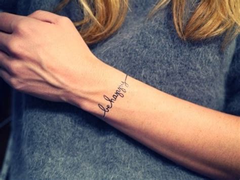 So, this is a wristband tattoo that is designed completely with different sized dots. Bracelet tattoo with important words | Wrist bracelet ...