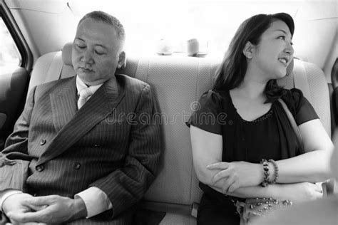 Mature Asian Businessman And Mature Asian Woman Exploring The City Together Stock Image Image