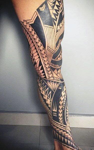 A Man S Leg With An Intricate Tattoo Design On The Side Of His Leg