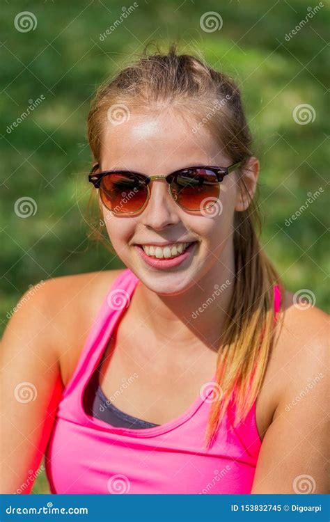 Pretty Young Teenager Girl With Sunglasses Front Of The Camera Stock