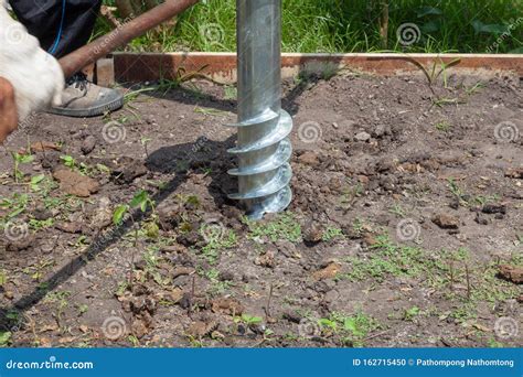 Worker Manual Drilling Hole On The Ground Stock Photo Image Of Hole