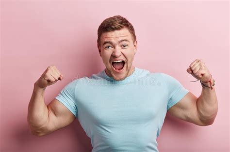 Cheerful Smiling Muscular Man In White Tshirt Shouting At The Camera Stock Image Image Of