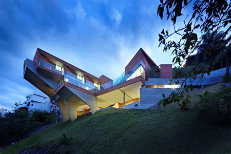 Sculptural Concrete House Built On A Steep Slope Modern House Designs