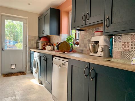 The majority of wood countertops are made from traditional butcher block, and while they may see some mild meal prep, they're rarely used for chopping these days. Blue Painted shaker kitchen with imitation wood. Wet zone ...