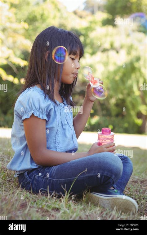 Cute Little Girl Blowing Bubbles Stock Photo Alamy
