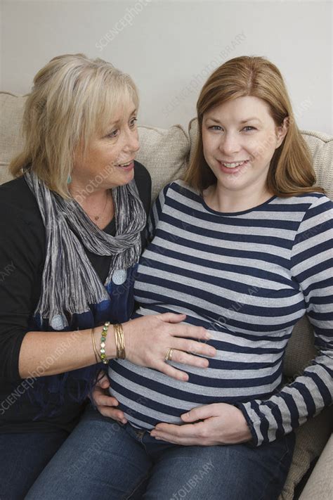 mother with pregnant daughter stock image c047 1263 science photo library