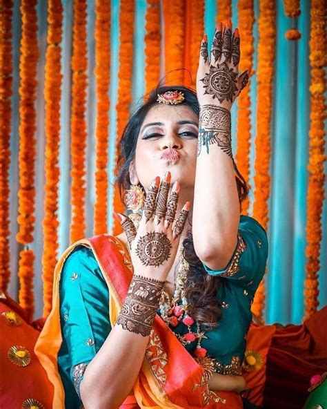 20 fun bridal mehndi poses you wouldn t want to miss indian wedding photography poses bride