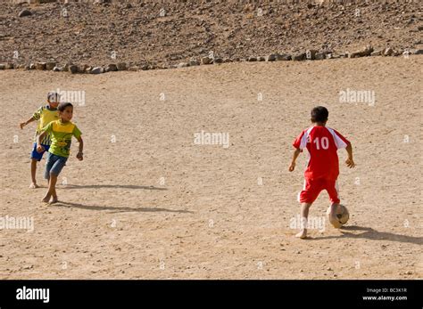 Children Playing Soccer Barefoot In Al Dakhiliyah Region Sultanate Of
