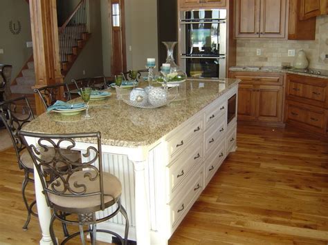 Kitchen islands with seating give your workspace and dining space and overall increased utility. pix of islands that seat 5? | Island with seating, Dream ...