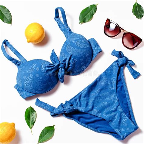 Travel Flat Lay With Classic Blue Color Swimsuit Green Leaves And