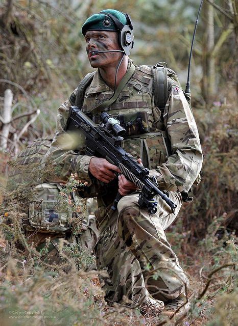 Royal Marine Commandos On Exercise In British Woodland By Defence