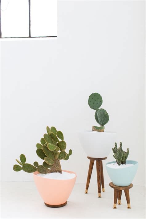 These quintessential mid century houseplants are beautiful on their own, but they look even better when featured in a modern planter. DIY Mid Century Stand Planters - Sugar & Cloth Decor