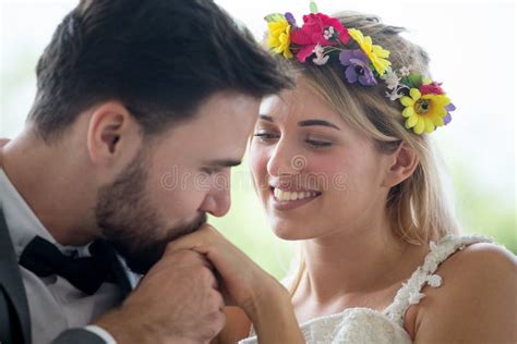 Young Couple In Love Wedding Bride And Groom Embracing Together On