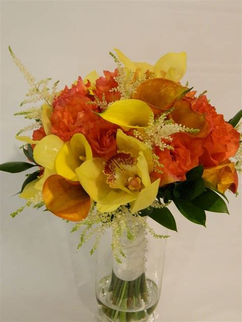 Wedding bouquets with yellow orange roses and lilly stargazer. Table Arrangement Example: Yellow and Orange Calla Lily ...