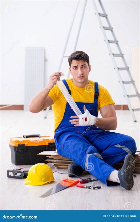 The Worker With Injured Hand At Construction Site Stock Image Image