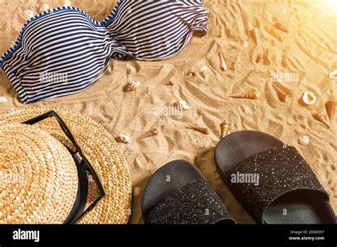 summer bikini and accessories stylish beach set beach bikini summer outfit and sea sand as