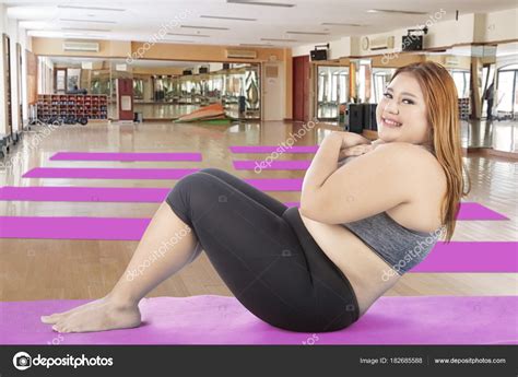 Caucasian Obese Woman Doing Crunches Stock Photo By Realinemedia