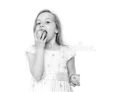 Cute Little Girl Eating An Apple Isolated On White Background Stock
