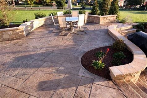 Stamped concrete is commonly used for patios, sidewalks, driveways, pool decks, and interior flooring. Stamped Concrete Patio with Seating Wall also has a fire ...